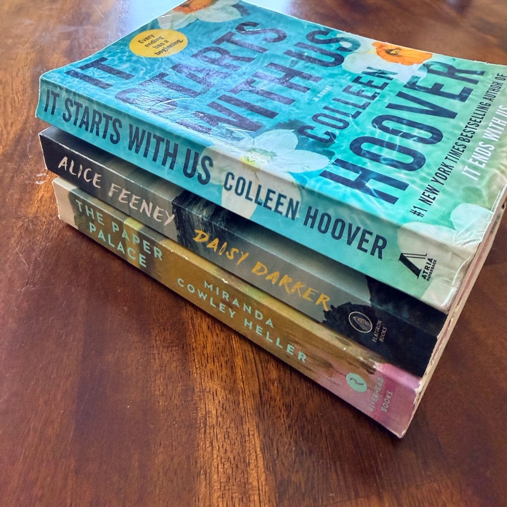 Three books: the famous 'It Starts With Us', Daisy Darker and The Paper Palace